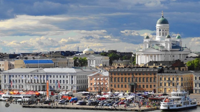 Helsinki Cathedral and waterfront with boats and market