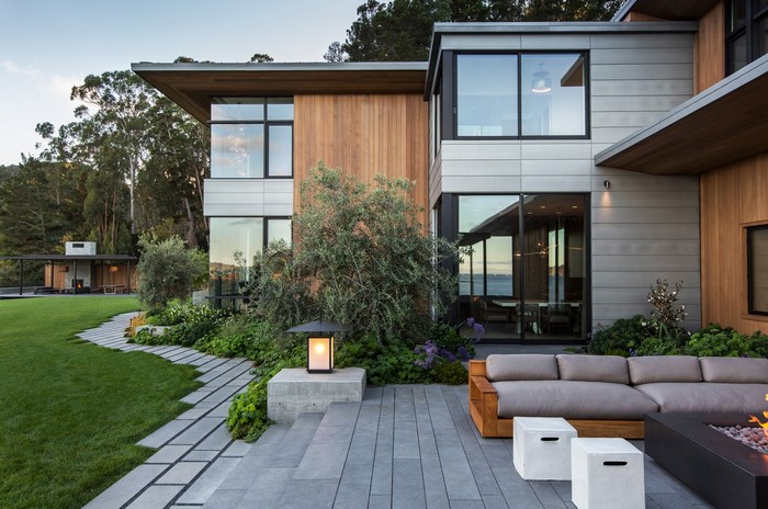 Modern house with outdoor seating and landscaping