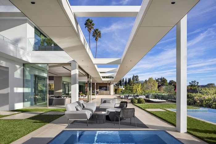 Modern house with outdoor living space and pool