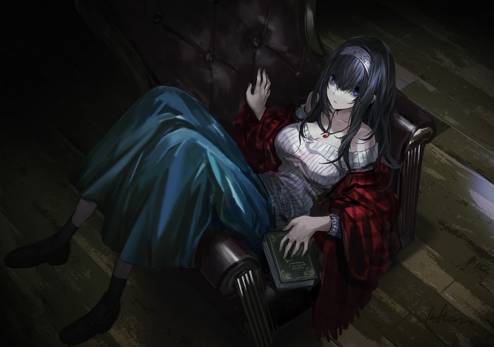 Anime girl sitting on a chair with a book