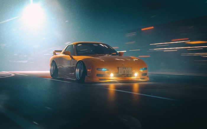 Yellow Mazda RX-7 FD driving at night