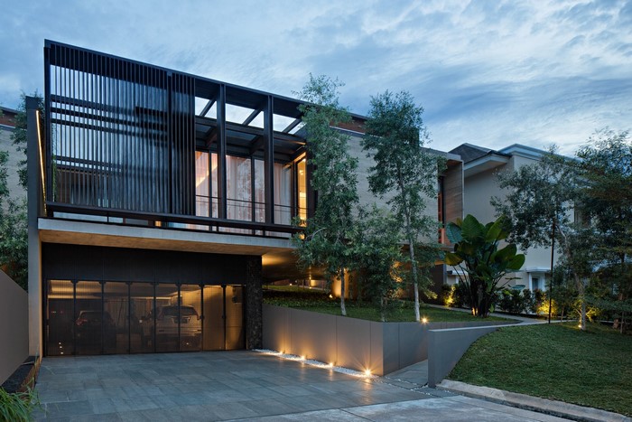 Modern house with garage and trees