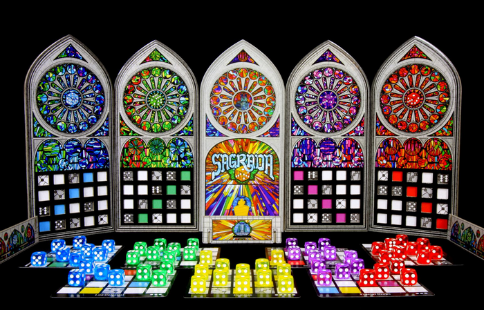 Sagrada board game with colorful dice and stained glass windows