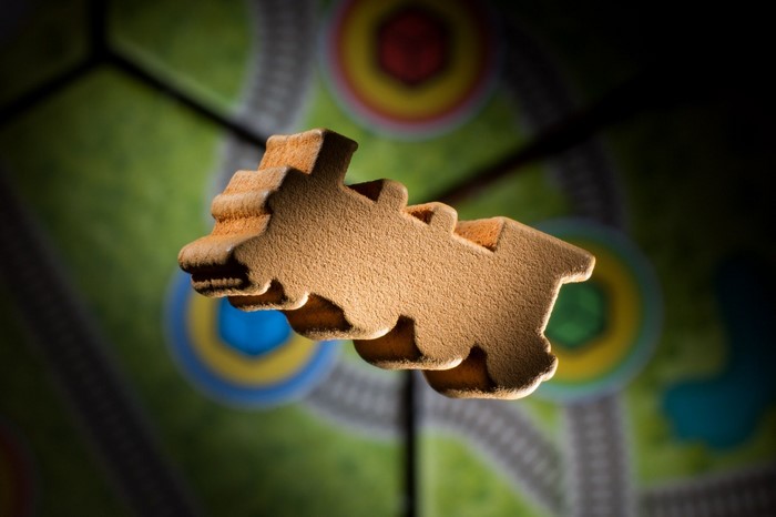 Wooden train token on a board game