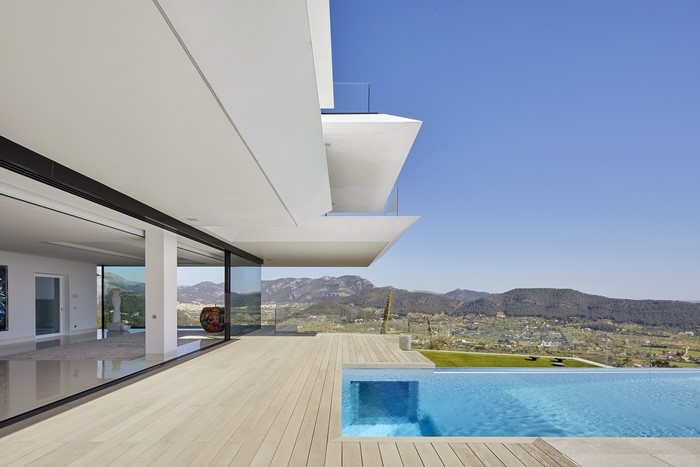 Modern luxury mansion with swimming pool and scenic view