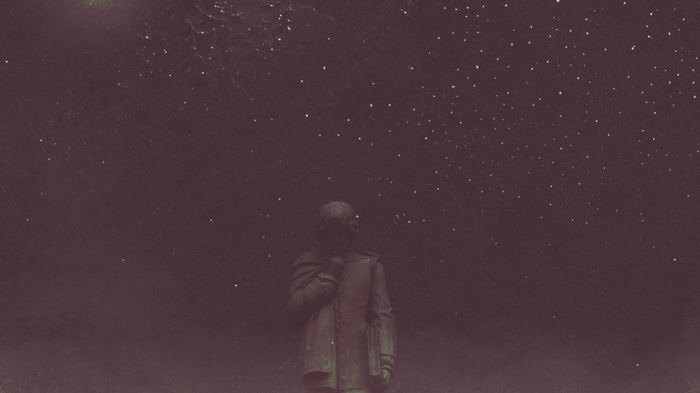 Statue under a starry sky