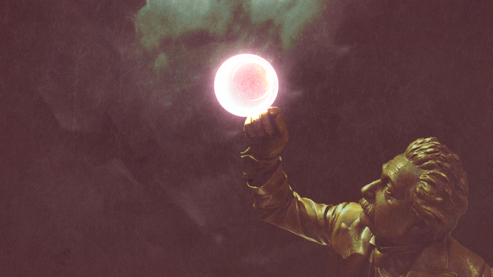 Albert Einstein statue holding a glowing sphere