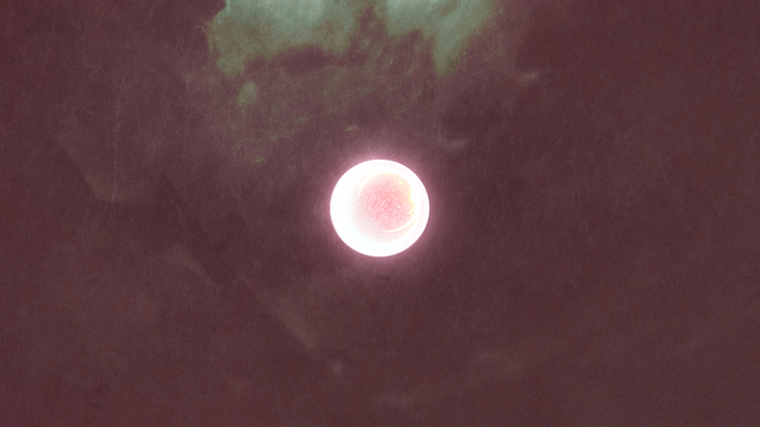 Glowing orb on dark textured background