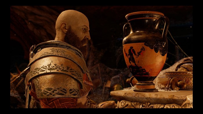 Kratos from God of War looking at an ancient vase