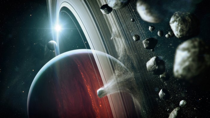 Planet with rings and asteroids in space