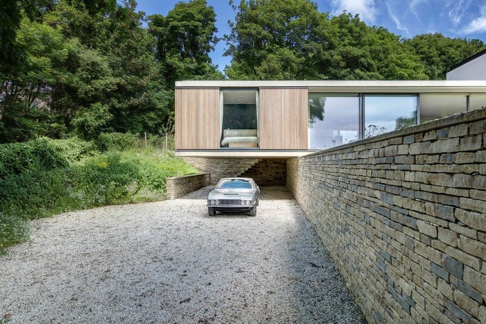 Modern house with a vintage car in the driveway
