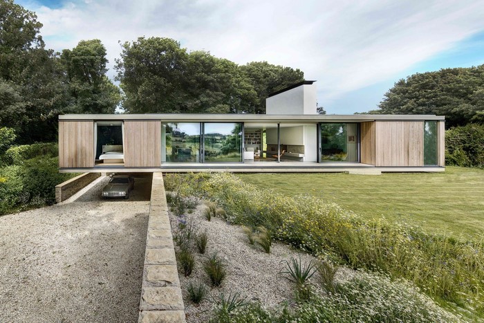 Modern house with car and natural landscape