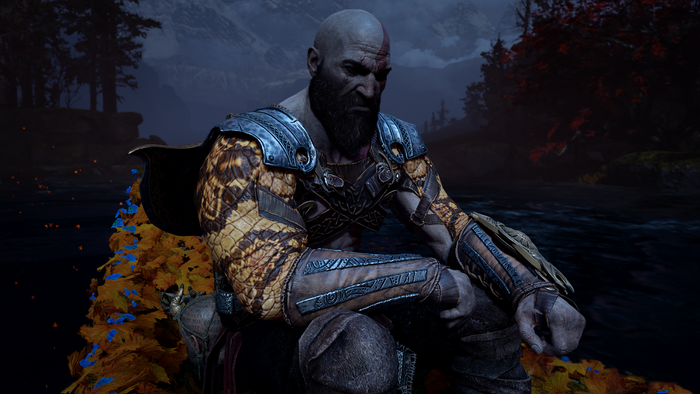 Kratos from God of War sitting by a body of water