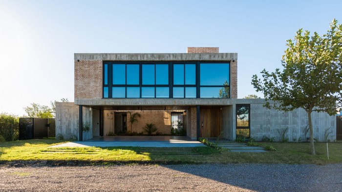 Modern concrete and brick house with large windows