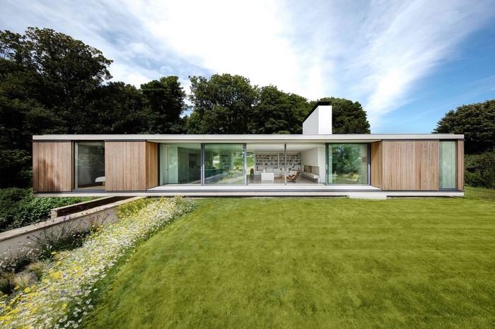Modern luxury house with wooden facade and large windows