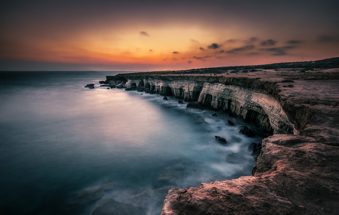 Sea cliffs at sunset with long exposure