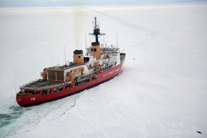U.S. Coast Guard icebreaker ship navigating through ice