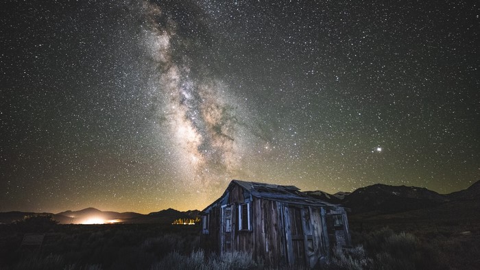Abandoned cabin under the Milky Way