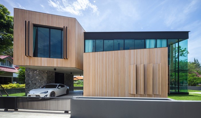 Modern wooden house with Toyota car
