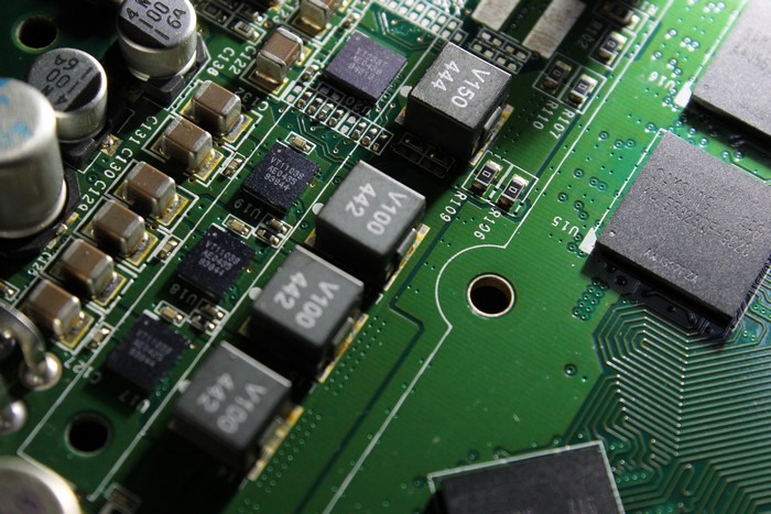 Close-up of a green circuit board with electronic components
