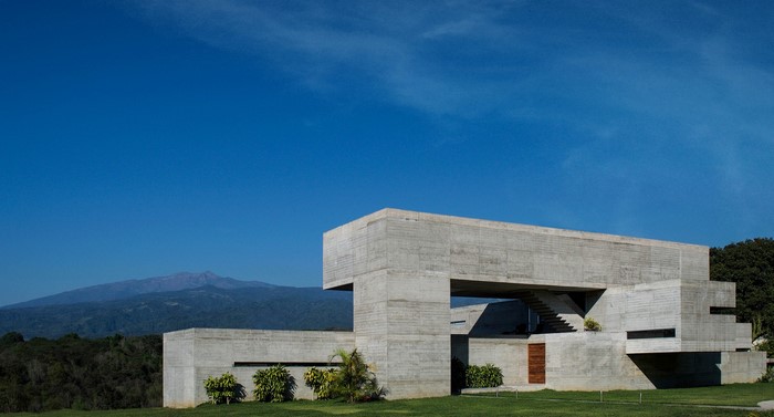 Modern concrete house with mountain background