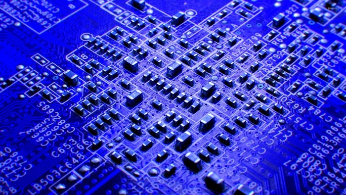 Close-up of a blue circuit board with many components