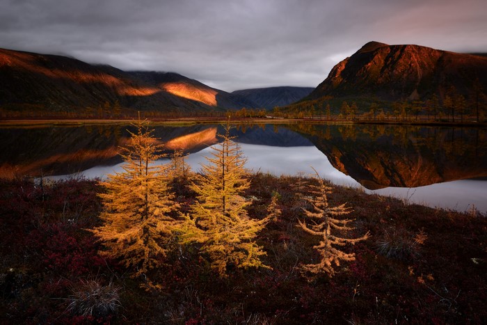 Autumn lake reflection at sunset in Russia
