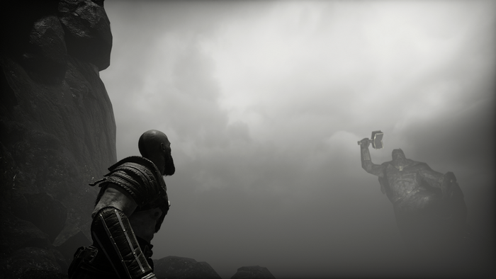Kratos from God of War facing a statue in fog