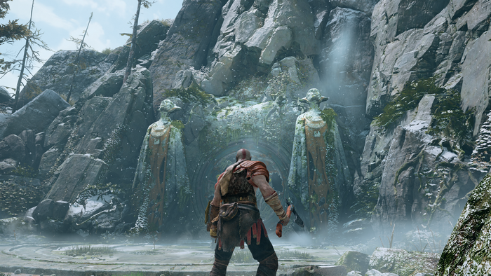Kratos from God of War (2018) in front of stone statues