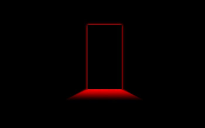 Minimalist red door in darkness