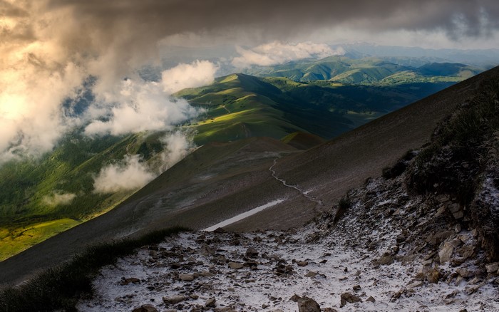 Mountain landscape with clouds and snow