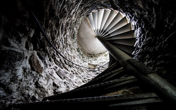 Spiral staircase inside a stone tower