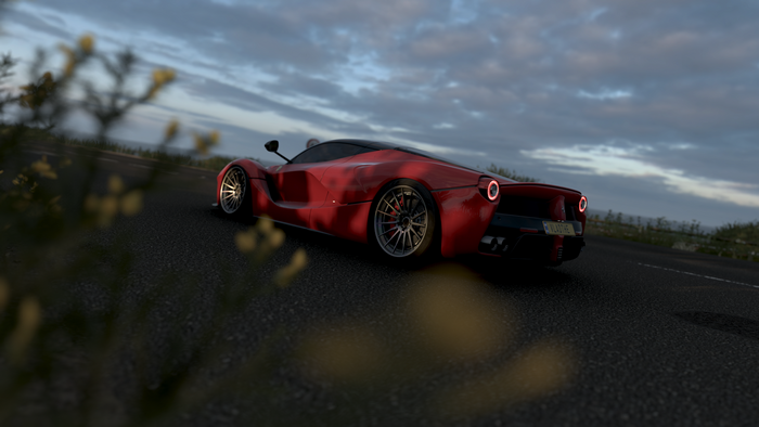 Red Ferrari LaFerrari driving on a road in Forza Horizon 4