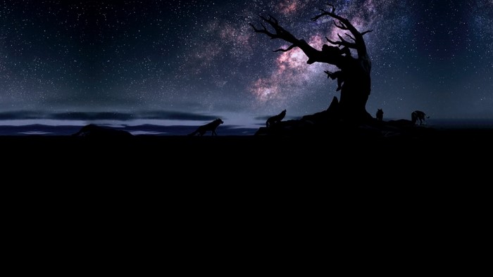 Wolves howling under a starry night sky near a dead tree