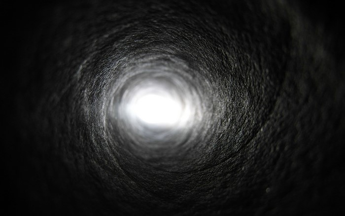 Dark tunnel with light at the end