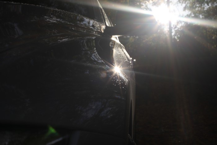 4K BMW 3 Series car with water droplets