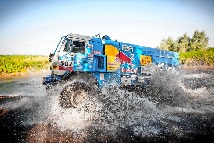 Kamaz truck racing through water