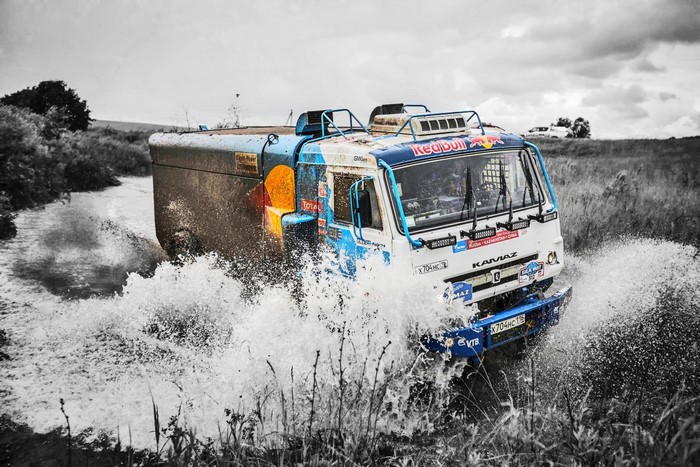 Kamaz truck racing through water