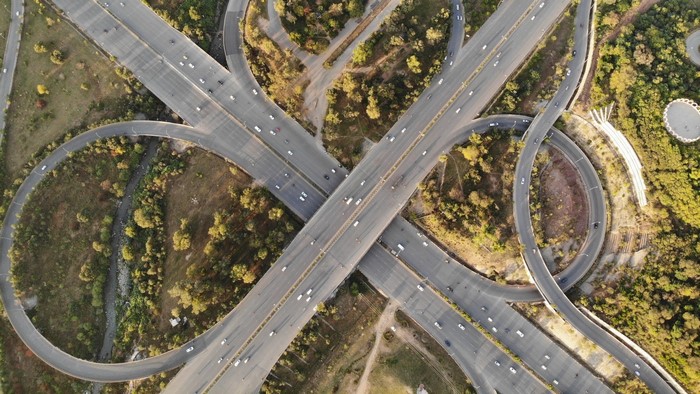 Aerial view of a complex highway interchange with traffic