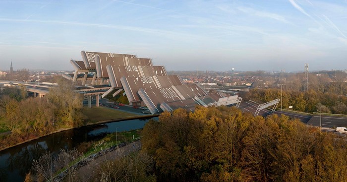 Surreal bridge architecture over a river and town