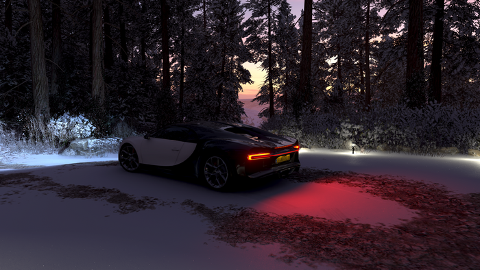 Bugatti Chiron in a snowy forest at dusk