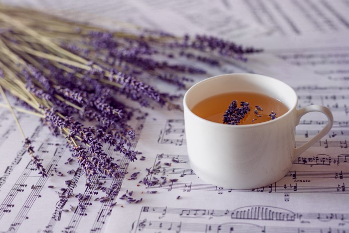 Lavender tea with lavender sprigs on sheet music