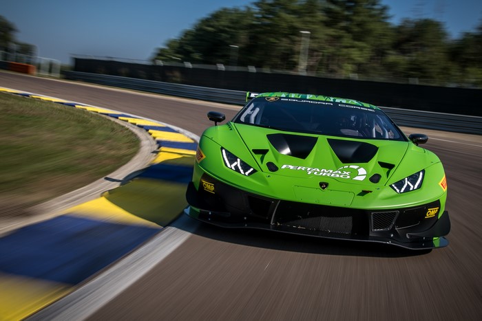 Green Lamborghini Huracan race car on track