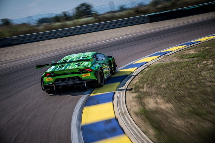 Green Lamborghini Huracan GT3 EVO race car on track