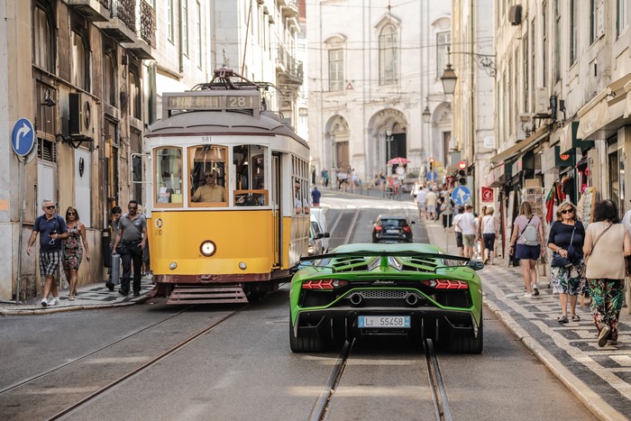 Green Lamborghini Aventador and Tram in Lisbon