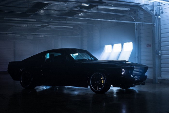 Black electric classic car in a garage