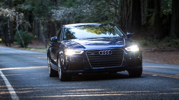 Blue 2015 Audi A3 Sedan on a Forest Road