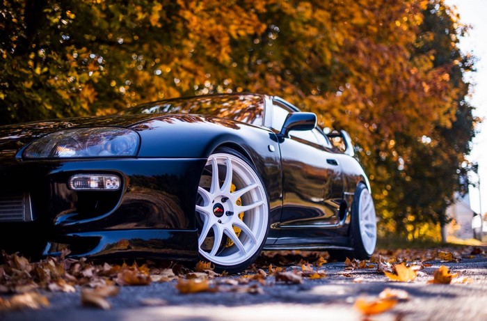 Toyota Supra with White Rims in Fall