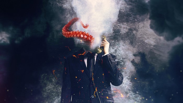Man in Suit with Octopus Tentacles for Head on Phone