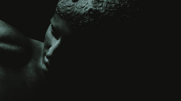 Close-up of a dark monochrome statue